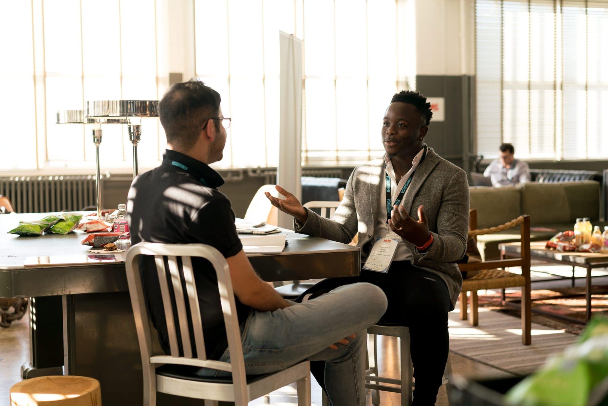 Two men talking in an office